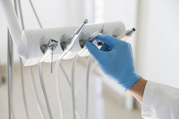 Professional Root Canal Treatment technician working in Massapequa Park, NY